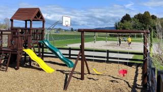 Playground, basketball half court and beach volleyball at Julians Berry Farm